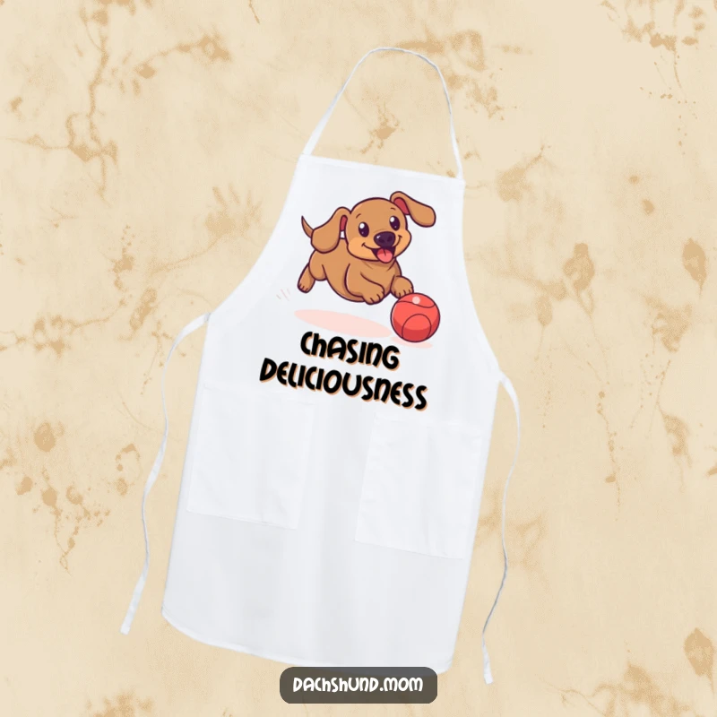 Funny kitchen apron depicting a dachshund playfully chasing a bouncing ball, ideal for kitchen fun.