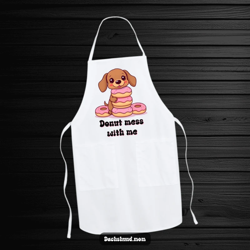 Funny Kawaii Dachshund Apron depicting a dog balancing a tower of donuts, perfect for a humorous cooking experience and gift.