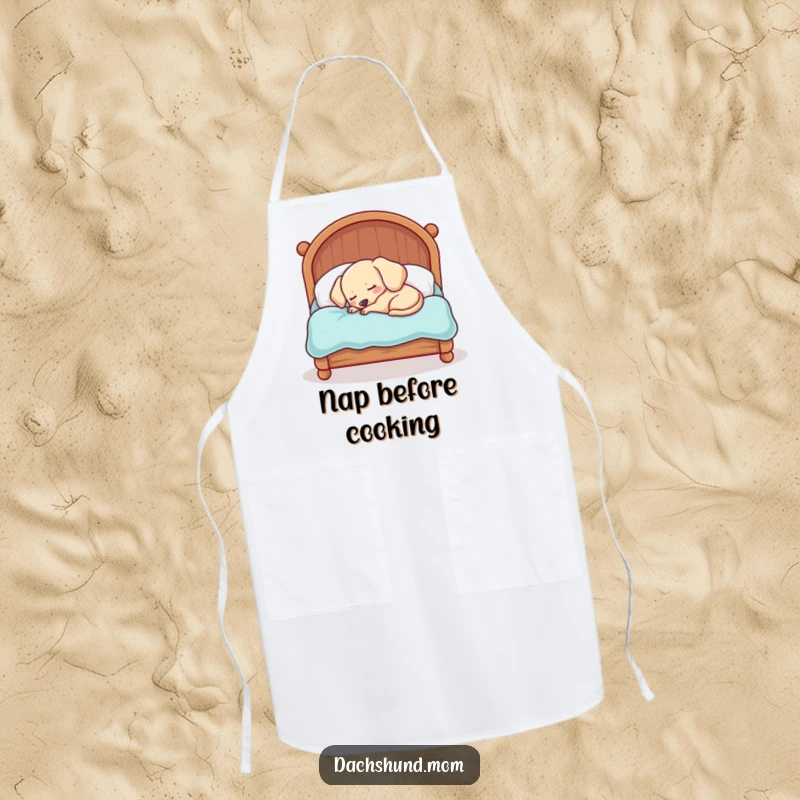 Funny Kawaii Dachshund Apron: A sleepy dog is hilariously cramped in a tiny bed, perfect for kitchen adventures and sweet dreams.