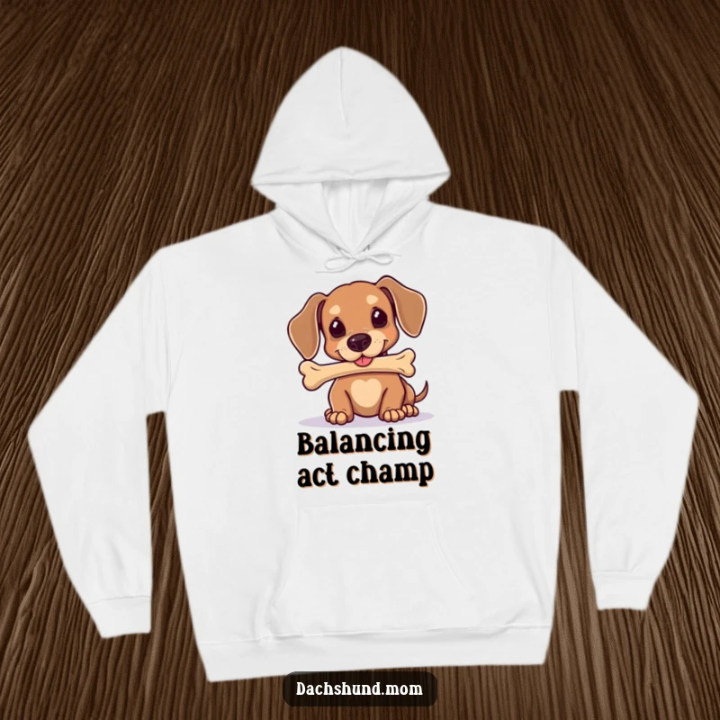 Funny Kawaii Dachshund Hoodie: A cute dog is hilariously focused on balancing a large bone on its nose, showcasing its skill.