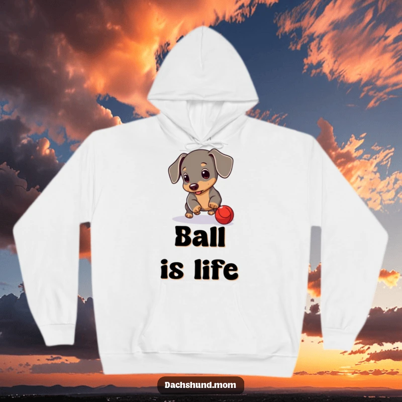 Funny Dachshund Cub Hoodie: A cute Dachshund puppy playing with a red ball. Comfortable and humorous clothing.