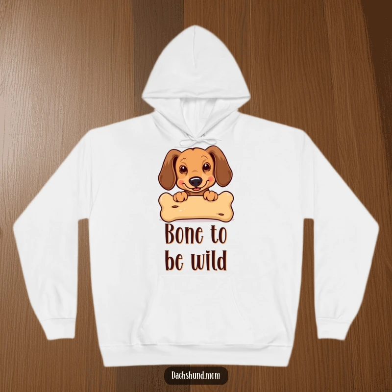 Funny Kawaii Dachshund Hoodie: a cute dachshund with ears flapping, enthusiastically peeking over a large bone, a delightful design.