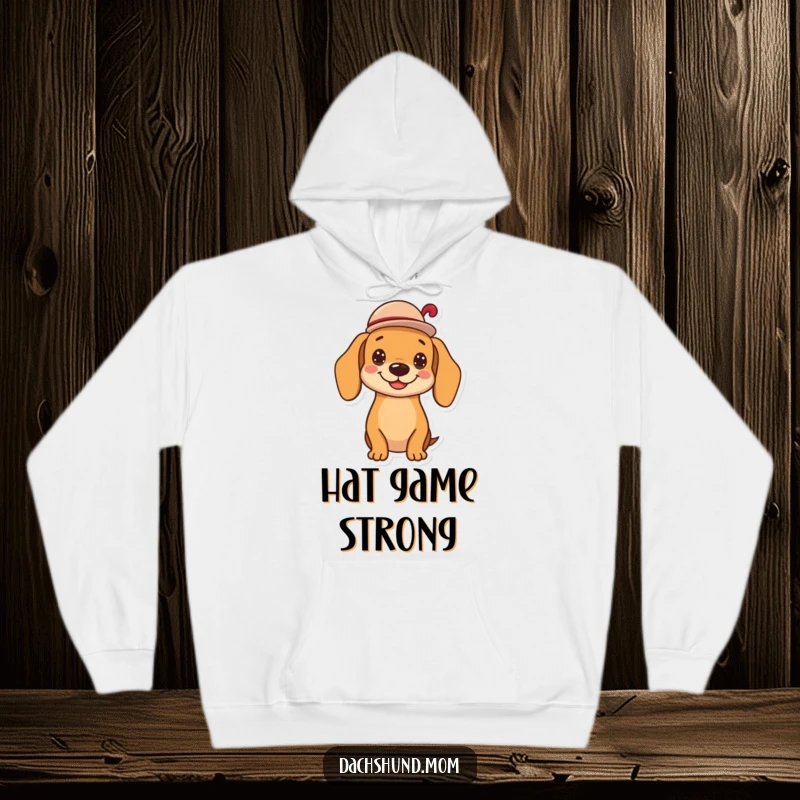 Funny kawaii dachshund hoodie, tipping a small hat with a cheerful grin, comfortable and humorous, perfect for a warm and stylish look, a great gift.