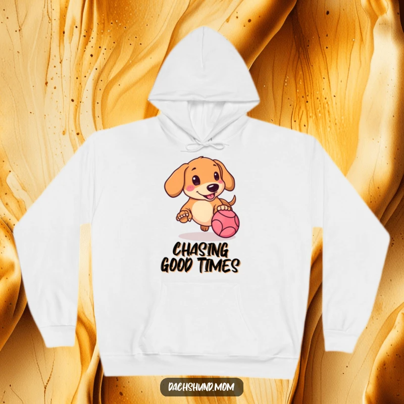 Funny Kawaii Dachshund Hoodie showing a rosy-cheeked doggle intensely chasing a brightly colored bouncing ball.