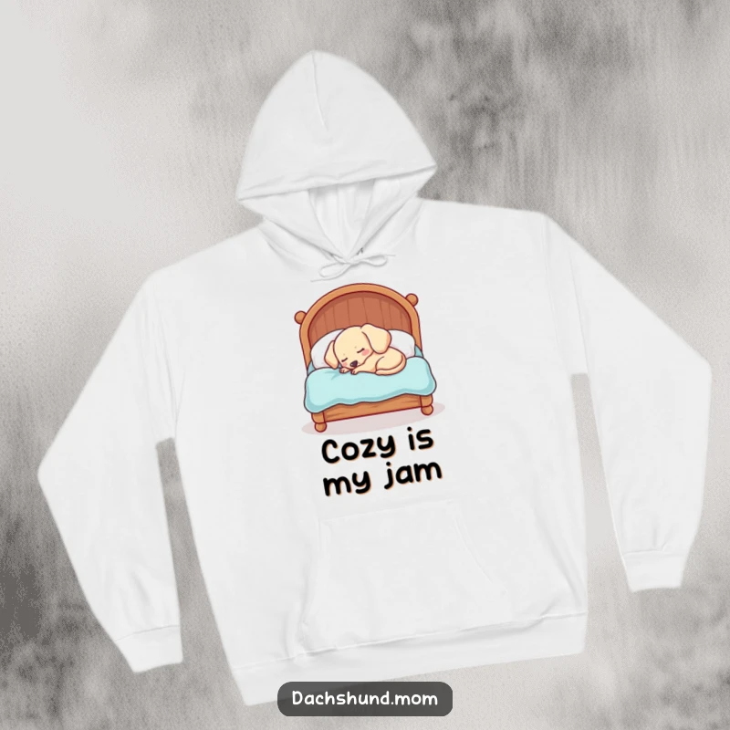 Funny Kawaii Dachshund Hoodie: A sleepy dog is hilariously crammed into a tiny bed, radiating ultimate cozy vibes.