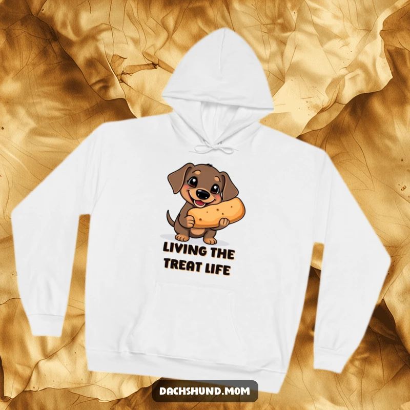 Funny Kawaii Dachshund Hoodie: a cute dachshund with a goofy grin is holding a comically oversized treat, looking incredibly happy.