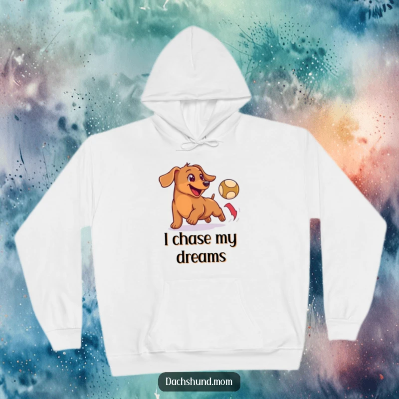 Funny hoodie featuring a happy, small wiener dog enthusiastically chasing a bouncing ball, radiating pure fun.