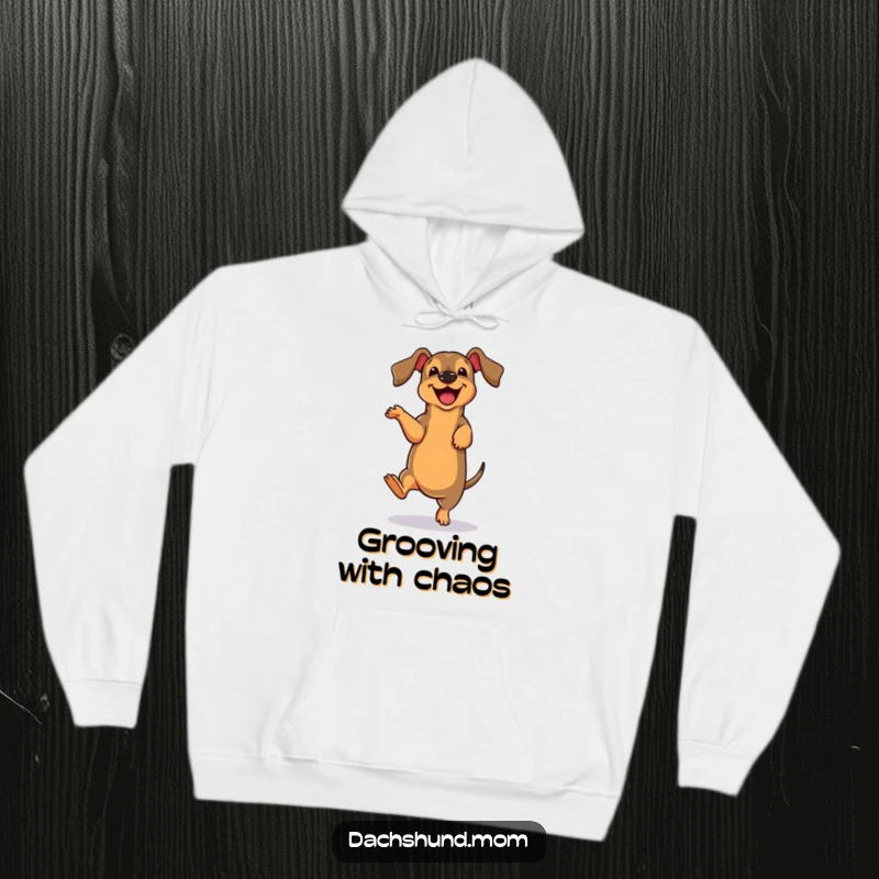 Funny cute dachshund character doing a joyful, clumsy dance move on a cozy hoodie, perfect for dog lovers.