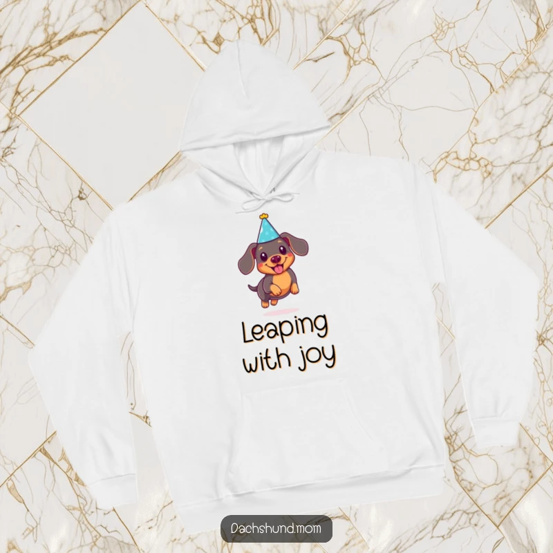 Funny Kawaii Dachshund Hoodie: Cute doxie in a party hat, joyfully leaping, offering warmth and playful humor.