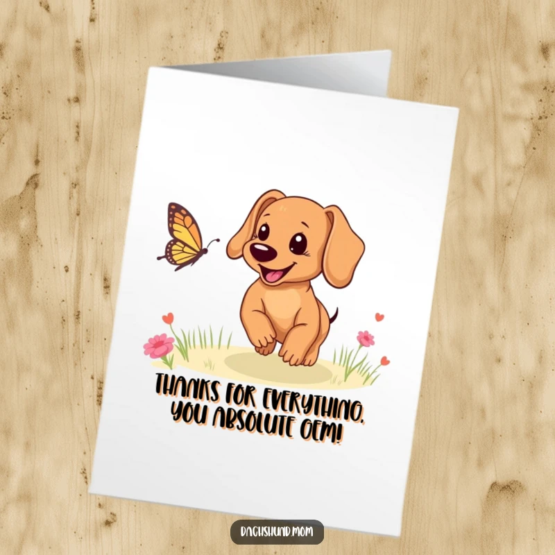 Funny free printable thank you card: A smiling Dachshund cub chases a butterfly, conveying thanks with joy.