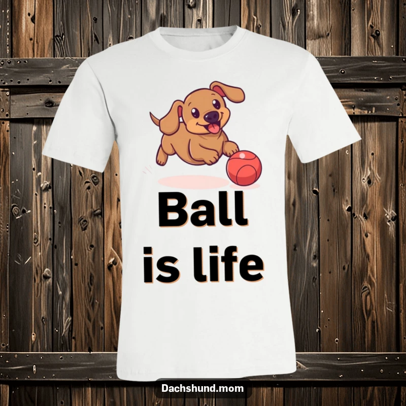 Funny t-shirt featuring a dachshund comically chasing a bouncing ball, showcasing its playful energy and determination.