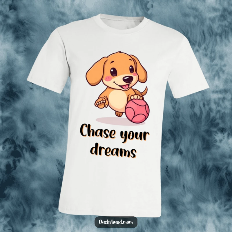 Funny Kawaii Dachshund T-Shirt featuring a rosy-cheeked pup energetically chasing a bouncing ball with delight.