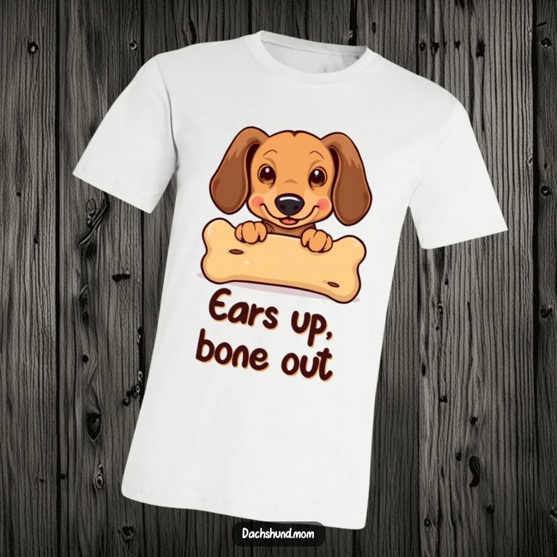 Funny Kawaii Dachshund T-Shirt: an excited dachshund with flapping ears peeking over a large bone, conveying pure doggy joy.
